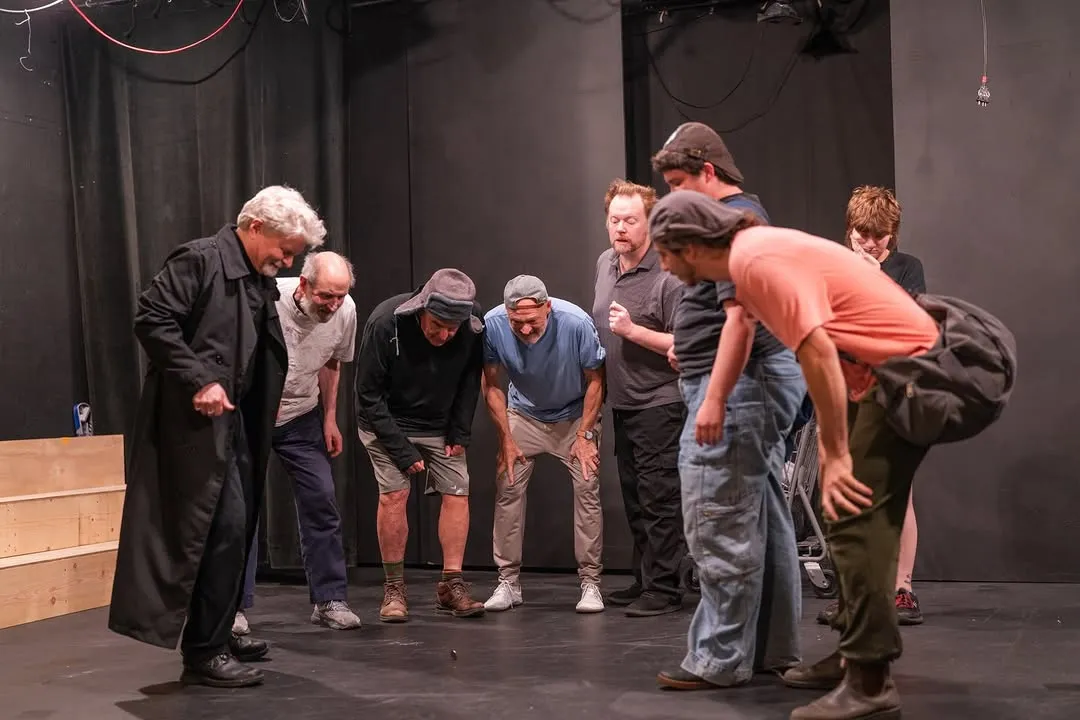 The rehearsal ensemble gathered together on stage.