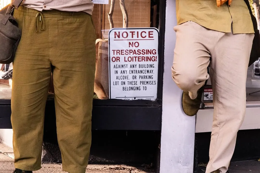 Detail of the leads’ costumes beside a no-trespassing sign.